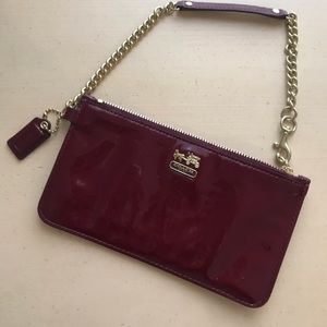 Burgundy patent leather Coach wristlet